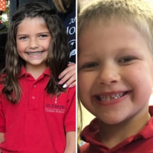 Two smiling children, one wearing braces, showcasing joy and friendship in a cheerful moment together.