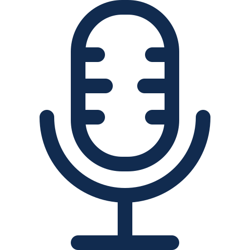 Simple dark blue icon of a classic microphone with a rounded top and vertical grill lines, representing audio recording or voice input, on a light background.